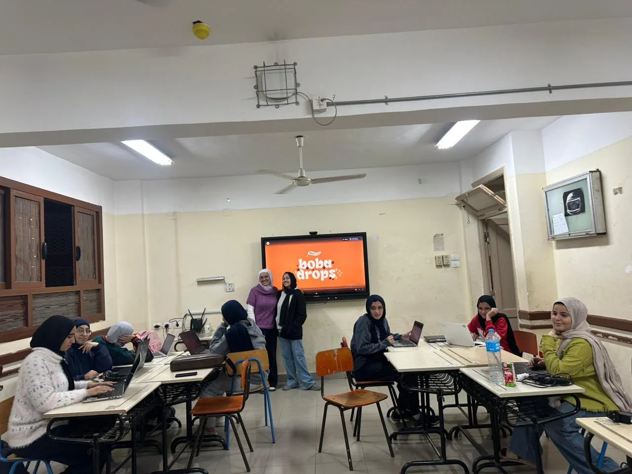 The girls' group working through the boba workshop together